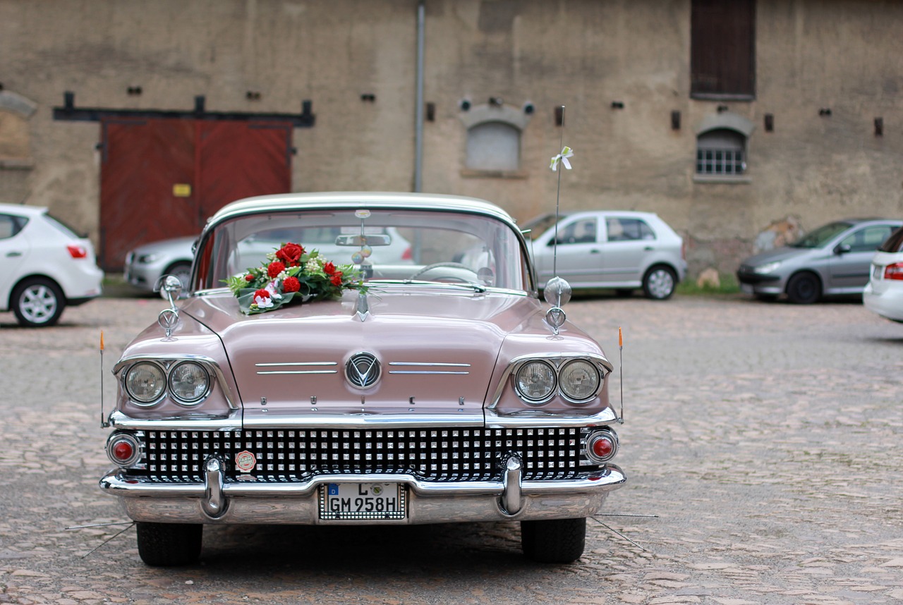 A vintage car, decorated with flowers